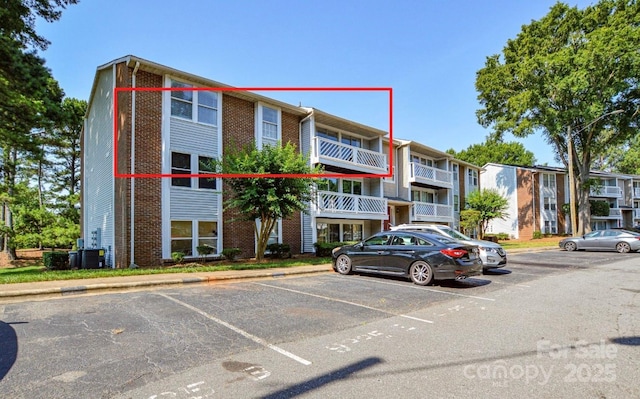 9325 Old Concord Rd Unit J, Charlotte, NC 28213 - view of apartment building / complex featuring uncovered parking