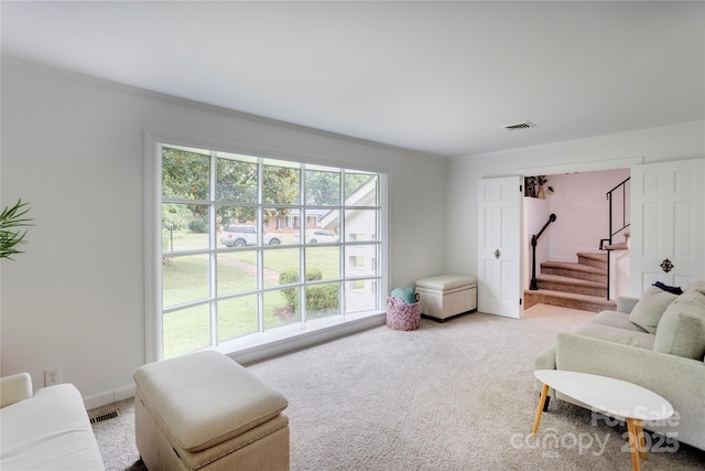 303 Odell St, Kannapolis, NC 28083 - living room featuring light carpet and stairs