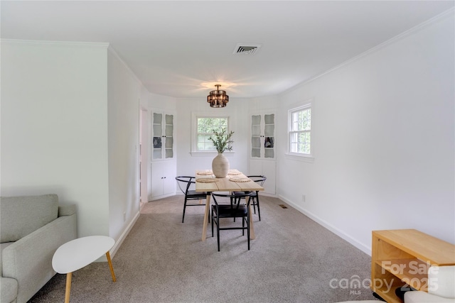303 Odell St, Kannapolis, NC 28083 - dining area featuring a chandelier, light colored carpet, and crown molding
