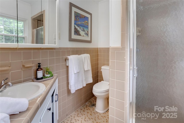 303 Odell St, Kannapolis, NC 28083 - full bath featuring vanity, a stall shower, and tile walls