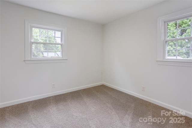 303 Odell St, Kannapolis, NC 28083 - carpeted empty room featuring baseboards