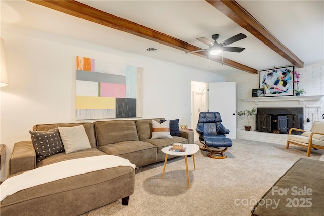 303 Odell St, Kannapolis, NC 28083 - living area featuring beam ceiling, carpet, a ceiling fan, and a fireplace