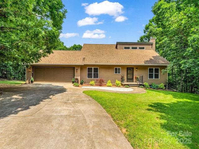 244 Timberlake Rd, Bostic, NC 28018 - view of front facade featuring concrete driveway, an attached garage, a front yard, roof with shingles, and a chimney