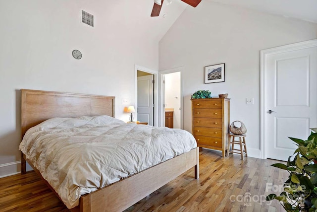 244 Timberlake Rd, Bostic, NC 28018 - bedroom featuring wood finished floors, high vaulted ceiling, connected bathroom, and a ceiling fan