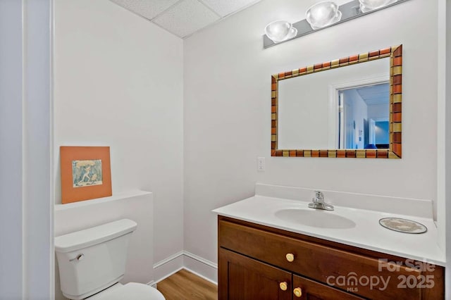 244 Timberlake Rd, Bostic, NC 28018 - half bath featuring vanity, a drop ceiling, and wood finished floors