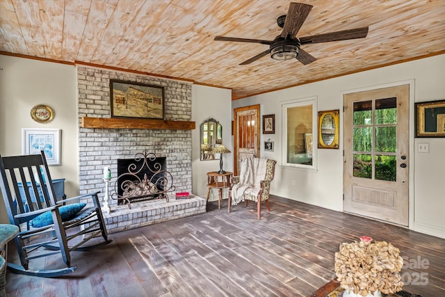 724 Teeter Rd, Mooresville, NC 28115 - living area featuring ornamental molding, wooden ceiling, wood finished floors, ceiling fan, and a fireplace