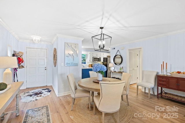 28 Toxaway Pt Unit B7, Lake Toxaway, NC 28747 - dining space with a chandelier, crown molding, and light wood-style floors
