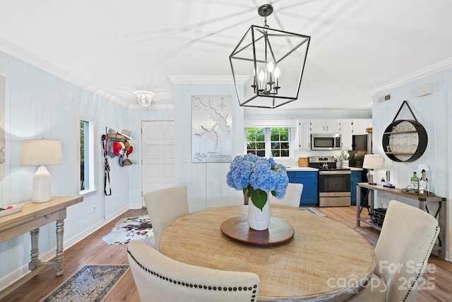 28 Toxaway Pt Unit B7, Lake Toxaway, NC 28747 - dining area featuring crown molding, a chandelier, and light wood-style flooring