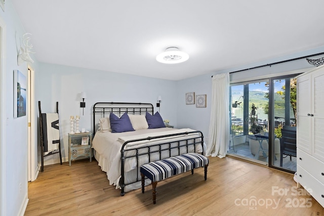 28 Toxaway Pt Unit B7, Lake Toxaway, NC 28747 - bedroom featuring access to exterior and light wood-style flooring