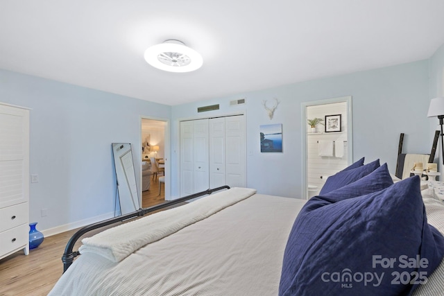 28 Toxaway Pt Unit B7, Lake Toxaway, NC 28747 - bedroom with wood finished floors, ensuite bathroom, and a closet