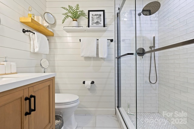 28 Toxaway Pt Unit B7, Lake Toxaway, NC 28747 - full bathroom with a stall shower, marble finish flooring, vanity, and wooden walls