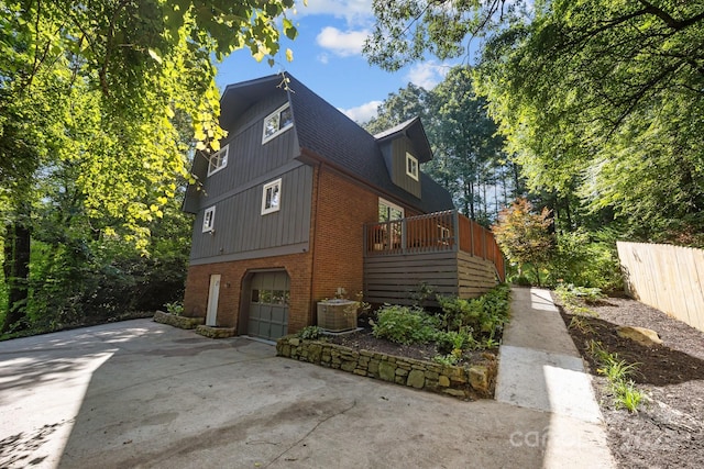 3276 Howard Gap Rd, Hendersonville, NC 28792 - view of home's exterior with brick siding, driveway, and a garage