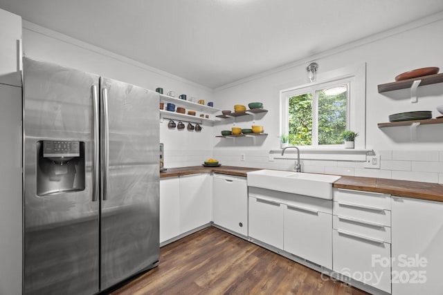 3276 Howard Gap Rd, Hendersonville, NC 28792 - kitchen featuring stainless steel refrigerator with ice dispenser, butcher block countertops, open shelves, backsplash, and crown molding