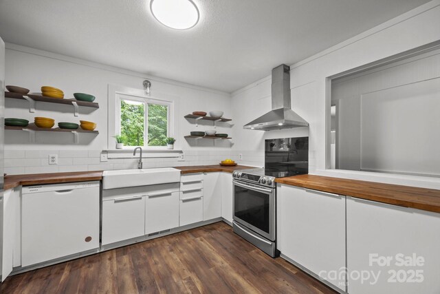 3276 Howard Gap Rd, Hendersonville, NC 28792 - kitchen featuring wood counters, dishwasher, open shelves, wall chimney exhaust hood, and stainless steel range with electric cooktop