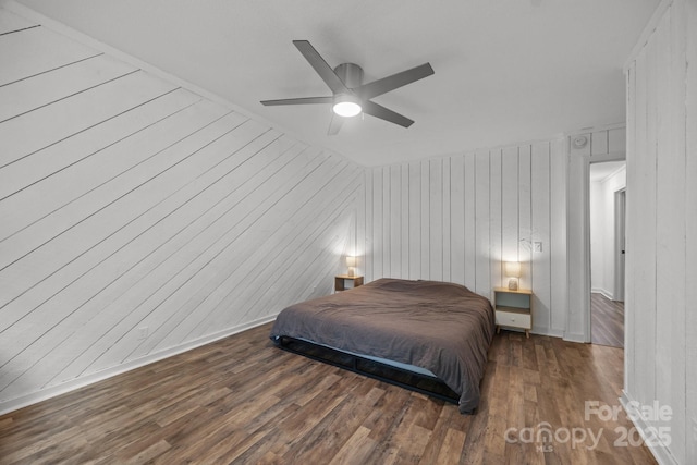 3276 Howard Gap Rd, Hendersonville, NC 28792 - bedroom with wood finished floors, a ceiling fan, and wooden walls