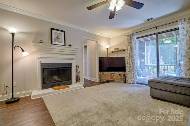 4130 Charlotte Hwy # G, Lake Wylie, SC 29710 - unfurnished living room featuring ceiling fan, crown molding, wood finished floors, and a fireplace with raised hearth