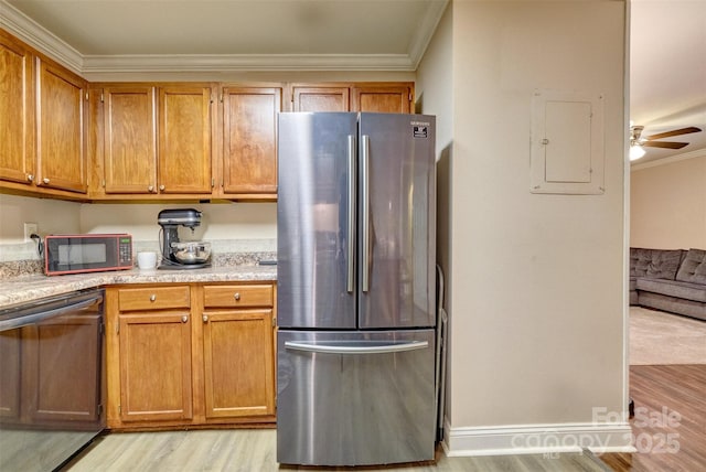 4130 Charlotte Hwy # G, Lake Wylie, SC 29710 - kitchen with freestanding refrigerator, black microwave, ornamental molding, light wood-style floors, and electric panel