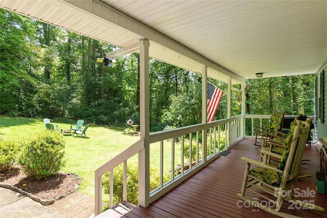 227 Acorn Ln, Pisgah Forest, NC 28768 - wooden porch with a lawn and an outdoor fire pit