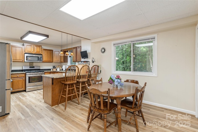 227 Acorn Ln, Pisgah Forest, NC 28768 - dining room with light wood finished floors and baseboards