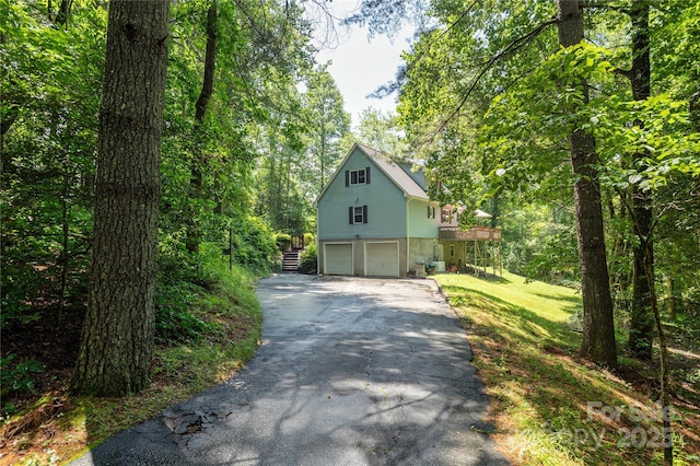 227 Acorn Ln, Pisgah Forest, NC 28768 - view of home's exterior featuring asphalt driveway and a garage