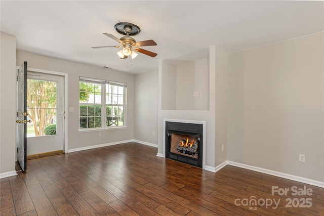 256 Farington Cir Unit 128, Fletcher, NC 28732 - unfurnished living room with ceiling fan, a lit fireplace, and wood-type flooring