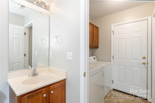 256 Farington Cir Unit 128, Fletcher, NC 28732 - bathroom with independent washer and dryer, vanity, and tile patterned floors