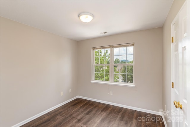 256 Farington Cir Unit 128, Fletcher, NC 28732 - unfurnished room with baseboards and dark wood-style flooring
