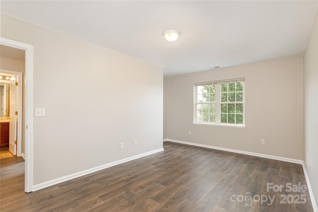 256 Farington Cir Unit 128, Fletcher, NC 28732 - spare room featuring dark wood-type flooring and baseboards