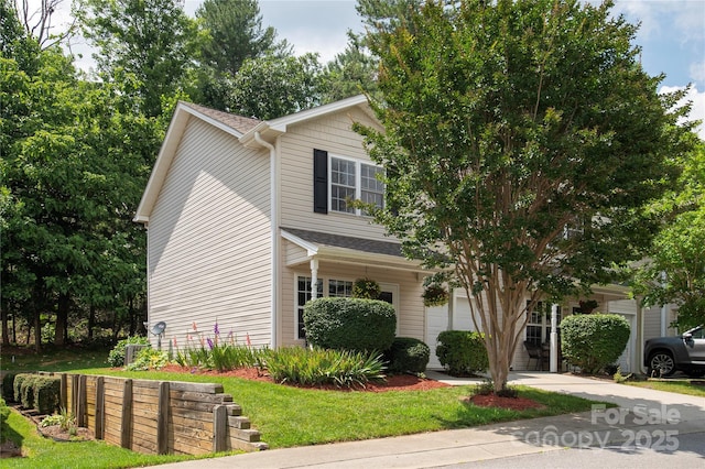 256 Farington Cir Unit 128, Fletcher, NC 28732 - obstructed view of property with a shingled roof and driveway