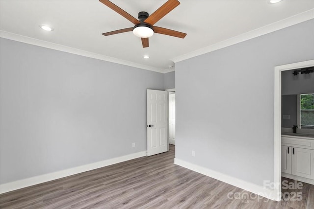 405 E Broad St, Salisbury, NC 28144 - unfurnished room featuring ceiling fan, crown molding, wood finished floors, and recessed lighting