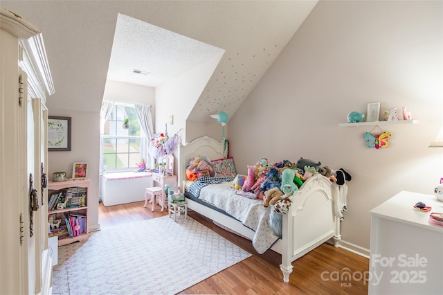 1274 Winding Path Rd, Clover, SC 29710 - bedroom featuring wood finished floors and vaulted ceiling