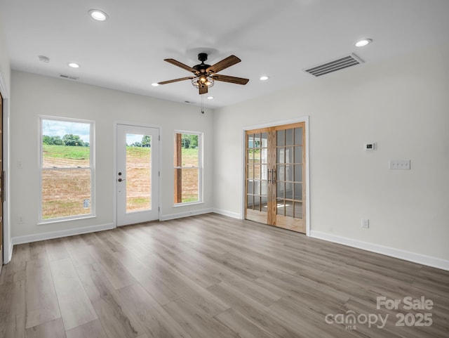 174 Charlie Randall Rd, Lawndale, NC 28090 - spare room featuring french doors, recessed lighting, a ceiling fan, wood finished floors, and a smoke detector
