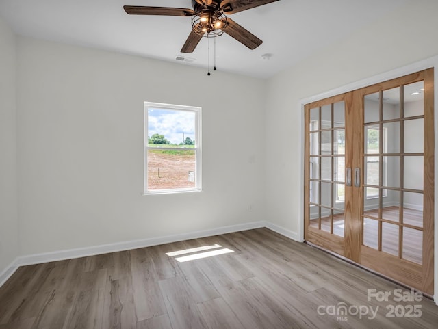 174 Charlie Randall Rd, Lawndale, NC 28090 - empty room featuring french doors, wood finished floors, and ceiling fan