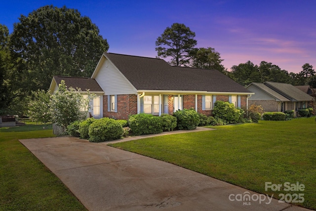 416 Park Ave, Granite Quarry, NC 28072 - view of front of home featuring brick siding, a front yard, roof with shingles, and driveway
