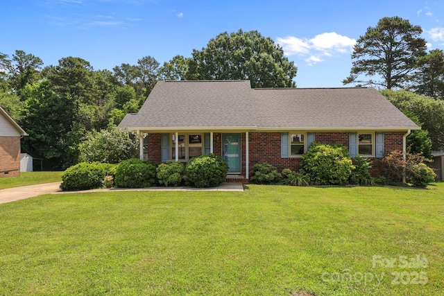 416 Park Ave, Granite Quarry, NC 28072 - view of front of home featuring brick siding, a front lawn, and a shingled roof