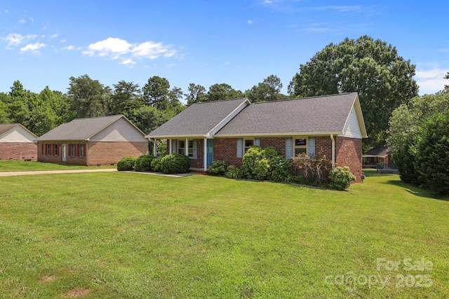 416 Park Ave, Granite Quarry, NC 28072 - view of front of house with brick siding and a front lawn