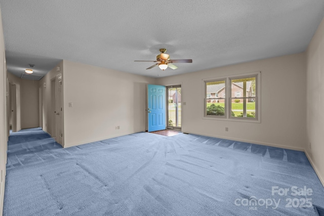 416 Park Ave, Granite Quarry, NC 28072 - unfurnished room featuring a ceiling fan, carpet floors, a textured ceiling, and attic access