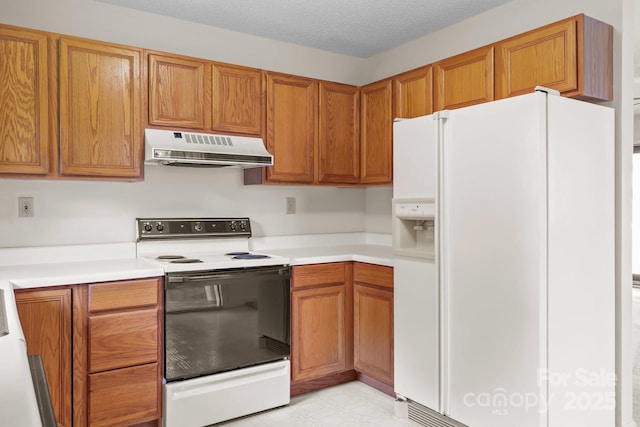 416 Park Ave, Granite Quarry, NC 28072 - kitchen featuring white appliances, under cabinet range hood, light countertops, and brown cabinetry