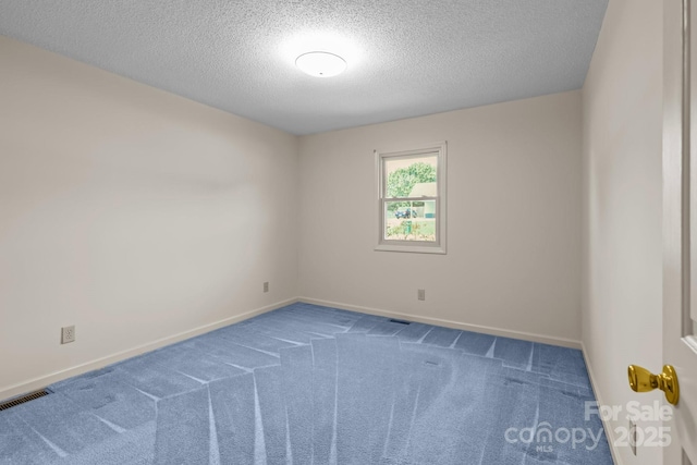 416 Park Ave, Granite Quarry, NC 28072 - carpeted spare room with a textured ceiling and baseboards