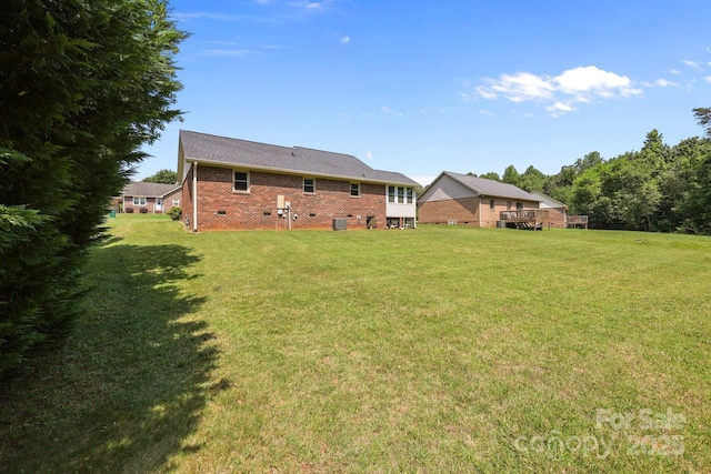 416 Park Ave, Granite Quarry, NC 28072 - rear view of house with a yard, brick siding, and crawl space