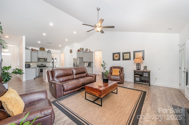7718 Village Pkwy, Locust, NC 28097 - living area featuring a ceiling fan, light wood-style floors, recessed lighting, and high vaulted ceiling