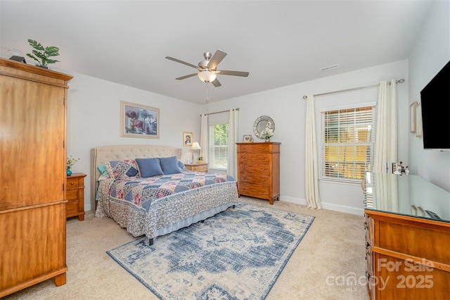 7718 Village Pkwy, Locust, NC 28097 - bedroom with light carpet and a ceiling fan