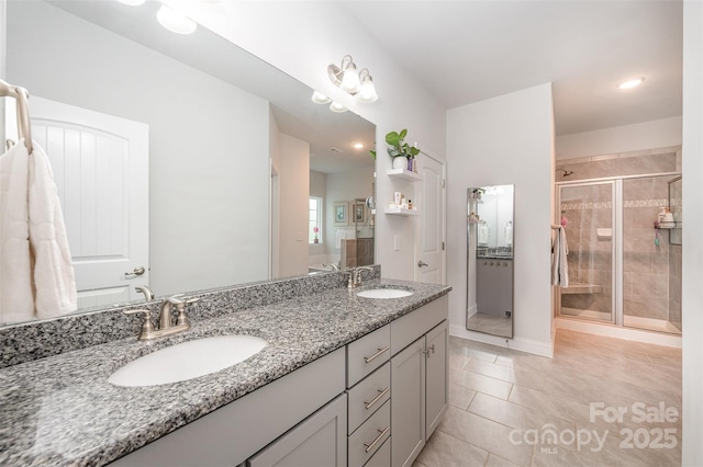 7718 Village Pkwy, Locust, NC 28097 - bathroom featuring double vanity, a shower stall, tile patterned floors, and recessed lighting