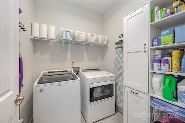 7718 Village Pkwy, Locust, NC 28097 - washroom featuring cabinet space and separate washer and dryer