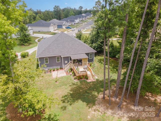 7718 Village Pkwy, Locust, NC 28097 - back of house featuring roof with shingles, a lawn, stairs, and a porch