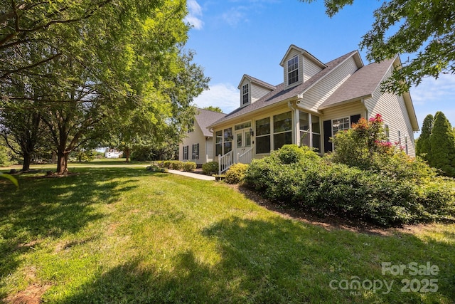 315 Talon Dr, Salisbury, NC 28147 - back of house with a sunroom, a yard, and a shingled roof
