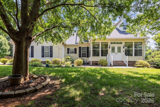 315 Talon Dr, Salisbury, NC 28147 - view of front of property featuring a shingled roof, a sunroom, entry steps, and a front lawn