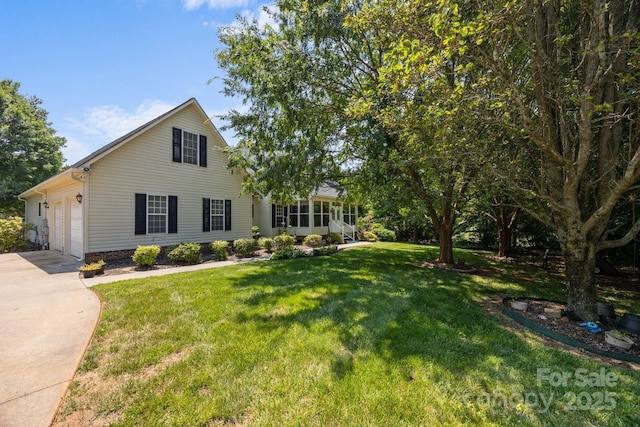 315 Talon Dr, Salisbury, NC 28147 - view of front of home with concrete driveway, a front yard, and a garage