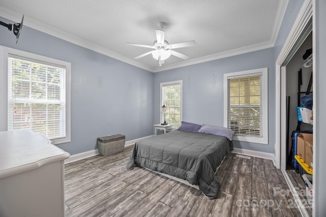 315 Talon Dr, Salisbury, NC 28147 - bedroom with wood finished floors, crown molding, a textured ceiling, and a ceiling fan