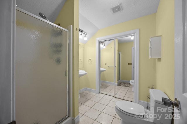 315 Talon Dr, Salisbury, NC 28147 - full bath featuring a shower stall, tile patterned floors, lofted ceiling, and a textured ceiling